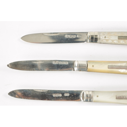 722 - A COLLECTION OF FOUR 19TH CENTURY SILVER FOLDING POCKET FRUIT KNIVES with mother-of-pearl handles.