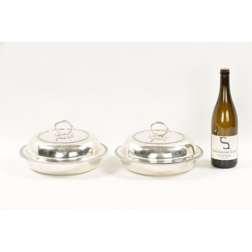 723 - A GOOD PAIR OF PAUL STORR CIRCULAR SILVER ENTREE DISHES OF LARGE SIZE the double-crested gadroon-edg... 