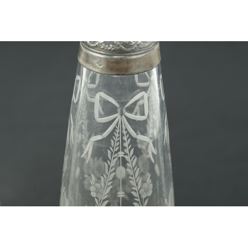 724 - A PAIR OF FRENCH SILVER TOPPED AND CUT GLASS DECANTER BOTTLES with floral etched bodies and Continen... 