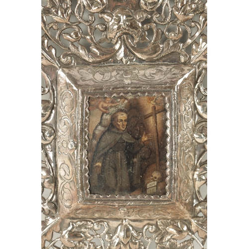 726 - AN EARLY 18TH CENTURY SOUTH AMERICAN SILVER FRAME of pierced embossed design with foliage and grotes... 