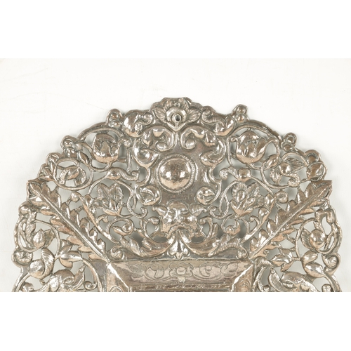 726 - AN EARLY 18TH CENTURY SOUTH AMERICAN SILVER FRAME of pierced embossed design with foliage and grotes... 