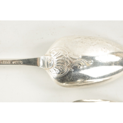 738 - A PAIR OF GEORGE III SILVER SCROLLED SHELLED BACK TABLESPOONS inscribed with initials and dated 1769... 