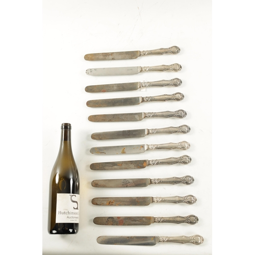 739 - A SET OF TWELVE VICTORIAN SILVER-HANDLED TABLE KNIVES Aaron Hadfield, Sheffield. (28cm long)