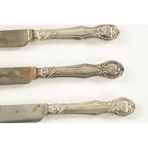 739 - A SET OF TWELVE VICTORIAN SILVER-HANDLED TABLE KNIVES Aaron Hadfield, Sheffield. (28cm long)