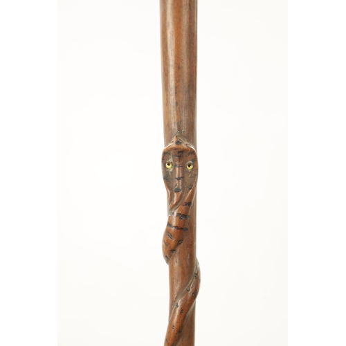 742 - A 19TH CENTURY AFRICAN HARDWOOD WALKING STICK with carved bust and snake, together with A 19TH CENTU... 