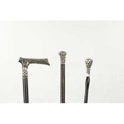 743 - A COLLECTION OF THREE 19TH CENTURY SILVER TOPPED WALKING STICKS comprising chequered, tree trunk and... 