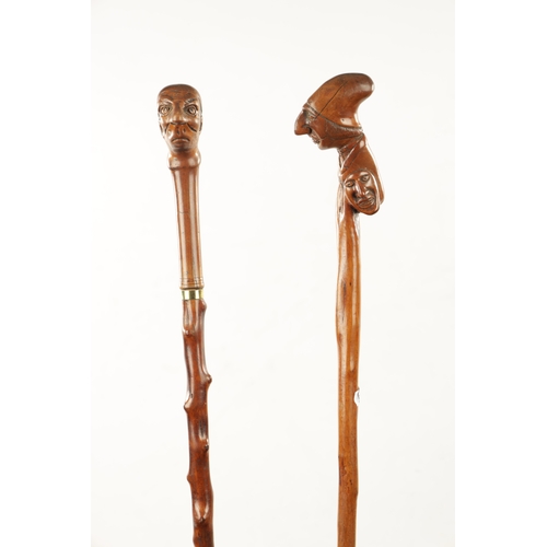 745 - TWO LATE 19TH CENTURY FOLK ART CARVED WALKING CANES one with carved handle formed as mans head and t... 