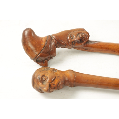 745 - TWO LATE 19TH CENTURY FOLK ART CARVED WALKING CANES one with carved handle formed as mans head and t... 