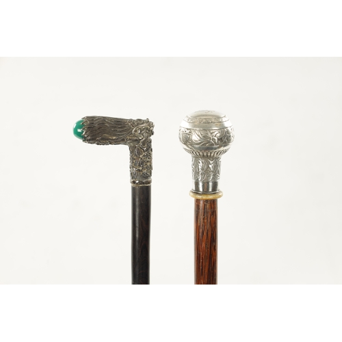 748 - TWO 19TH CENTURY CHINESE SILVER AND STONE-TOPPED WALKING STICKS one with an inset turquoise stone on... 