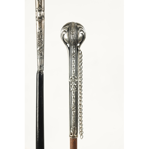 749 - A COLLECTION OF THREE LATE 19TH CENTURY SILVER TOPPED LONG-HANDLED WALKING STICKS of classical flora... 