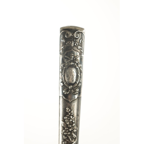 749 - A COLLECTION OF THREE LATE 19TH CENTURY SILVER TOPPED LONG-HANDLED WALKING STICKS of classical flora... 