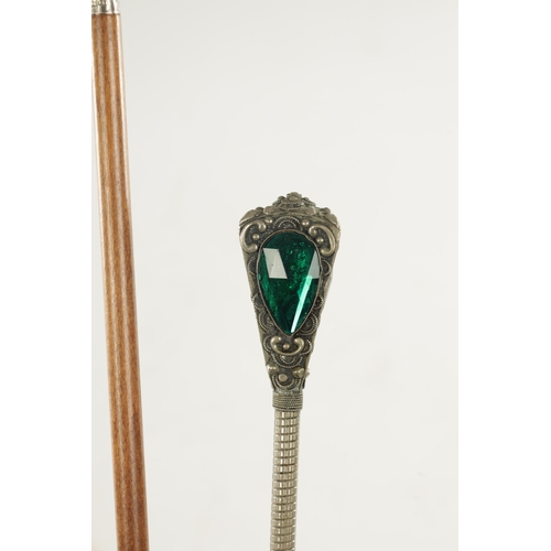 752 - A COLLECTION OF FOUR LATE 19TH CENTURY SILVER AND WHITE METAL TOPPED WALKING STICKS of various desig... 