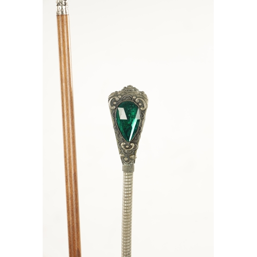 752 - A COLLECTION OF FOUR LATE 19TH CENTURY SILVER AND WHITE METAL TOPPED WALKING STICKS of various desig... 