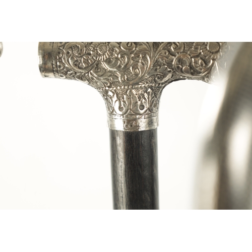 760 - A COLLECTION OF THREE 19TH CENTURY SILVER TOPPED WALKING STICKS two with embossed floral design, the... 