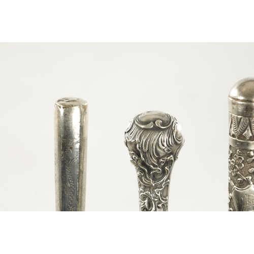 762 - A COLLECTION OF THREE 19TH CENTURY LONG HANDLED SILVER TOPPED WALKING STICKS comprising two embellis... 