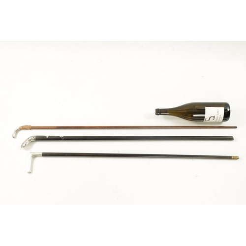 763 - OF GOLFING INTEREST, A COLLECTION OF THREE 19TH CENTURY SILVER TOPPED WALKING STICKS formed as golf ... 