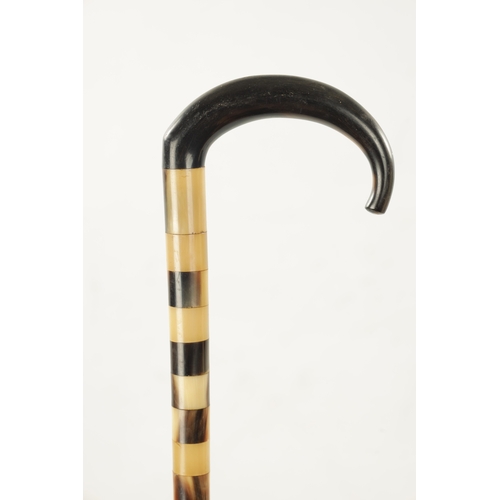 764 - AN EARLY 19TH CENTURY WHALE BONE WALKING STICK with carved ring work decoration together with A SEGM... 