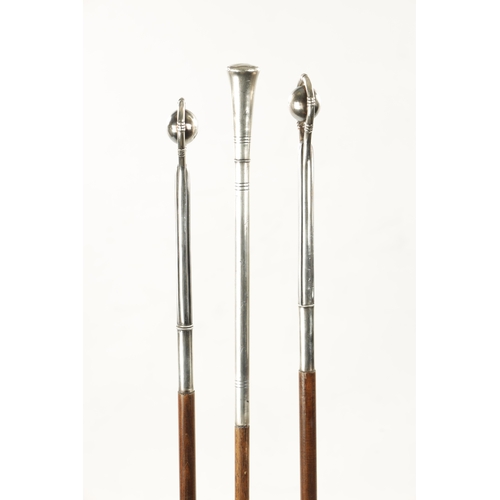 766 - A COLLECTION OF THREE 19TH CENTURY SILVER TOPPED WALKING STICKS two formed with loop and ball handle... 