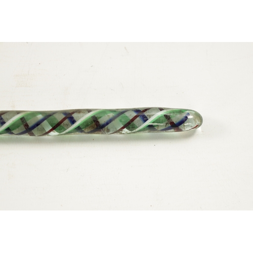 772 - A LATE 19TH CENTURY GLASS WALKING STICK with spiralled coloured glass decoration. (98cm long)