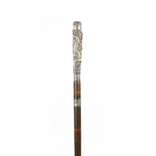 773 - A LATE 19TH CENTURY CHINESE SILVER WALKING STICK with engraved dragon to the handle, on a segmented ... 