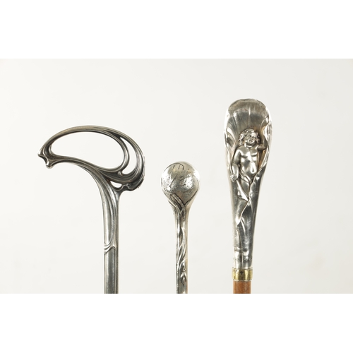 777 - A COLLECTION OF THREE ART NOUVEAU SILVER TOPPED WALKING STICKS (91cm long)