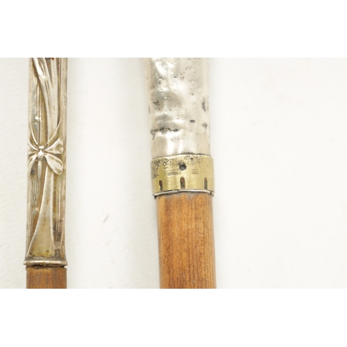 777 - A COLLECTION OF THREE ART NOUVEAU SILVER TOPPED WALKING STICKS (91cm long)