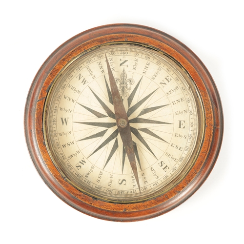 784 - AN OVERSIZED GEORGE III MAHOGANY COMPASS the printed calibrated paper dial and double sided steel po... 