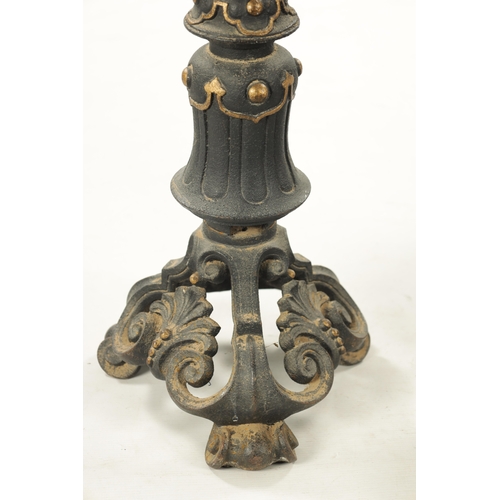 793 - A PAIR OF LATE 19TH CENTURY CAST IRON FIRE DOGS of gothic design. (67cm high)