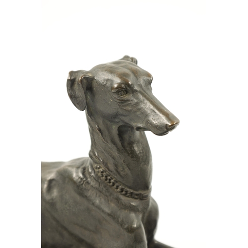 1001 - A 19TH CENTURY FRENCH PATINATED BRONZE SCULPTURE modelled as a recumbent greyhound dog mounted on an... 