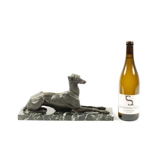 1001 - A 19TH CENTURY FRENCH PATINATED BRONZE SCULPTURE modelled as a recumbent greyhound dog mounted on an... 