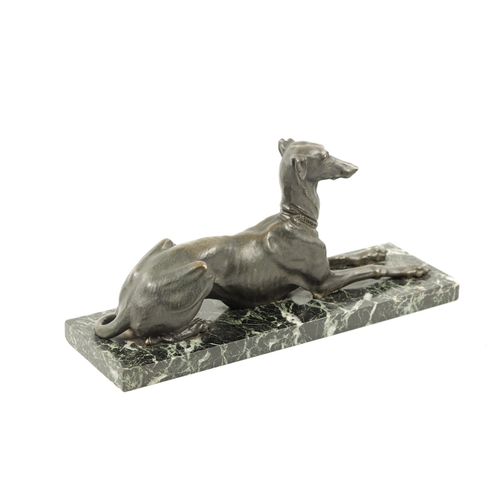 1001 - A 19TH CENTURY FRENCH PATINATED BRONZE SCULPTURE modelled as a recumbent greyhound dog mounted on an... 