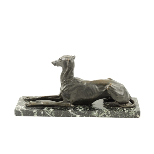 1001 - A 19TH CENTURY FRENCH PATINATED BRONZE SCULPTURE modelled as a recumbent greyhound dog mounted on an... 