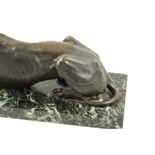 1001 - A 19TH CENTURY FRENCH PATINATED BRONZE SCULPTURE modelled as a recumbent greyhound dog mounted on an... 