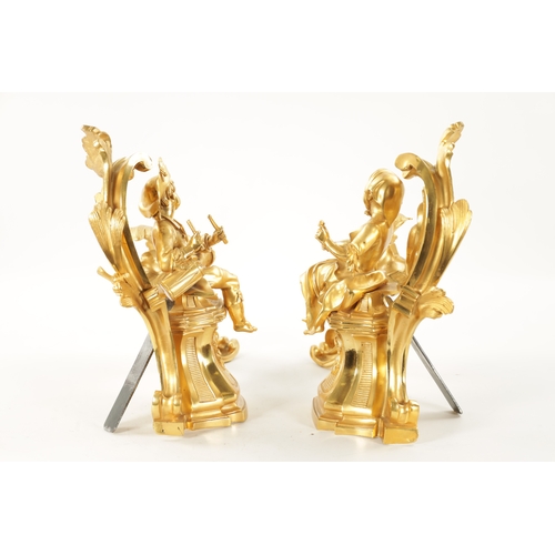 1003 - A PAIR OF 19TH CENTURY GILT ORMOLU CHENETS OF ROCOCO CHIPPENDALE DESIGN the leaf swirled bodies moun... 