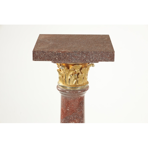 1004 - A PAIR OF 20TH CENTURY PORPHYRY TYPE AND ORMOLU MOUNTED COLUMNS with tapering stems and square bases... 