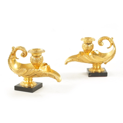 1008 - A PAIR OF 19TH CENTURY GILT BRASS REGENCY STYLE CANDLESTICKS shaped as shells on marble bases (15cm ... 