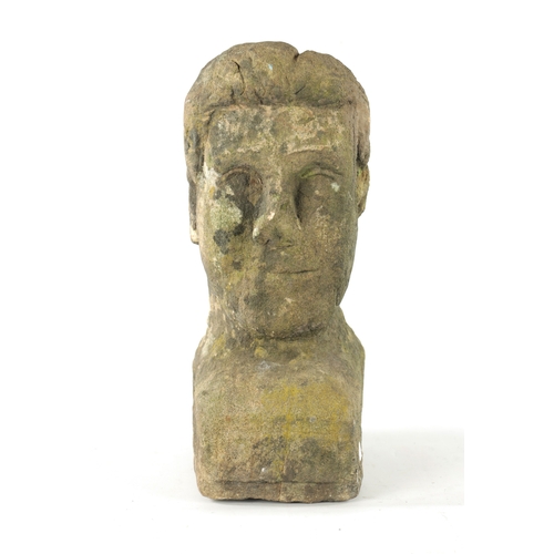 1013 - AN EARLY CARVED STONE BUST of a young man (35cm high )