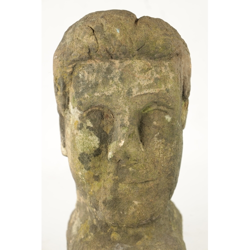 1013 - AN EARLY CARVED STONE BUST of a young man (35cm high )