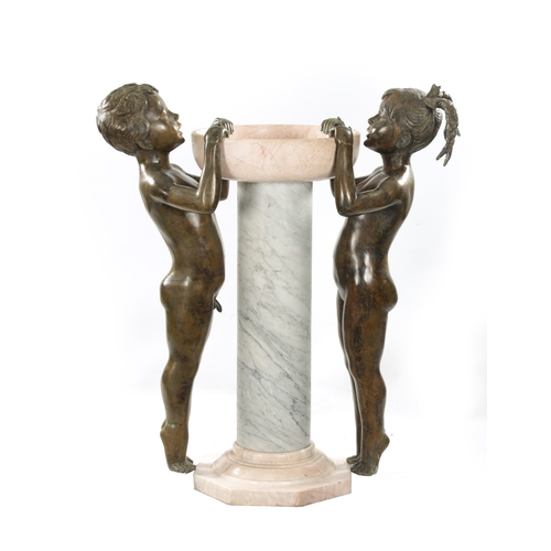 1014 - A 20TH CENTURY FIGURAL BRONZE AND MARBLE FOUNTAIN Having life size bronze figures of a boy and girl ... 