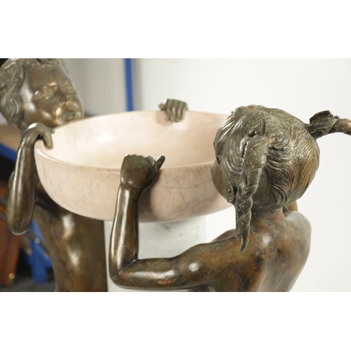 1014 - A 20TH CENTURY FIGURAL BRONZE AND MARBLE FOUNTAIN Having life size bronze figures of a boy and girl ... 