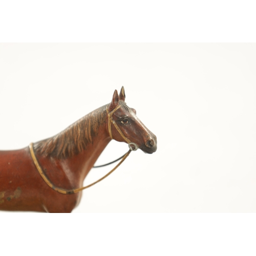 1021 - AN EARLY 20TH CENTURY COLD PAINTED BRONZE AND ONYX DESK TIDY modelled as a standing horse. (12cm hig... 