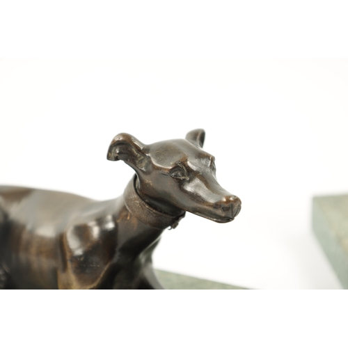 1029 - A PAIR OF FRENCH 19TH CENTURY PATINATED BRONZE SCULPTURES modelled as recumbent greyhounds mounted o... 