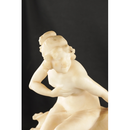 1037 - AN ART NOUVEAU CARVED ALABASTER FIGURE OF A SEMI-NUDE LADY seated on a naturalistic base. (49cm high... 