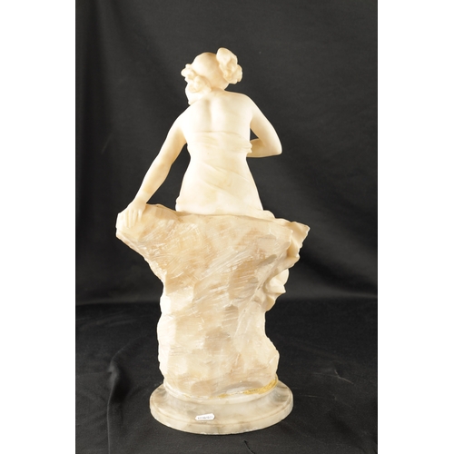 1037 - AN ART NOUVEAU CARVED ALABASTER FIGURE OF A SEMI-NUDE LADY seated on a naturalistic base. (49cm high... 