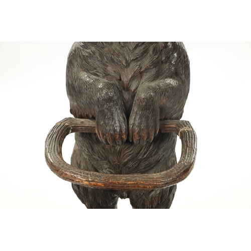 1040 - A LATE 19TH CENTURY CARVED BLACK FOREST BEAR STICK STAND Modelled as a standing bear with inset glas... 