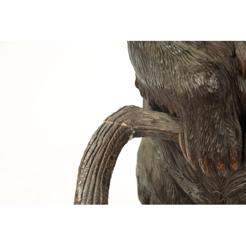 1040 - A LATE 19TH CENTURY CARVED BLACK FOREST BEAR STICK STAND Modelled as a standing bear with inset glas... 