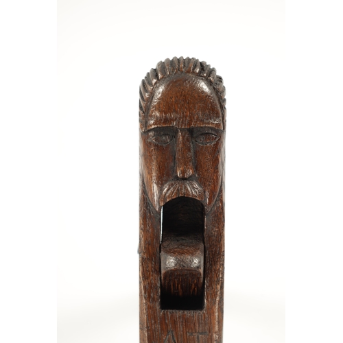 1043 - A PRIMITIVE MID 18TH CENTURY FOLK ART NUT CRACKER modelled as a man head initialled A.J. and dated 1... 