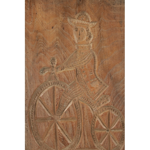 1044 - AN UNUSUAL 19TH CENTURY CARVED WOOD DOUBLE-SIDED GINGERBREAD MOULD depicting a figure riding a bicyc... 