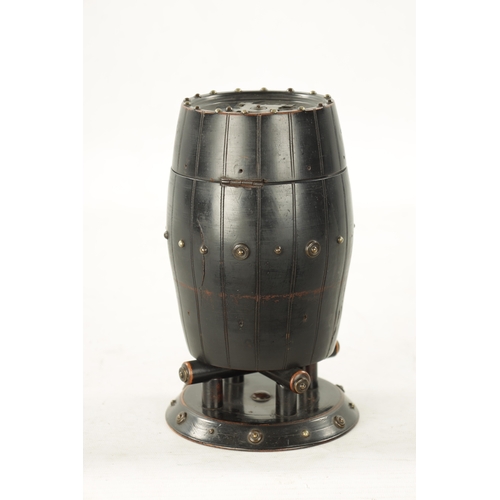 1047 - A 19TH CENTURY EBONISED CARVED WOOD TEA CADDY IN THE FORM OF A BARREL with applied stud work decorat... 