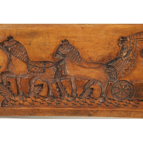 1050 - AN UNUSUAL 18TH CENTURY DUTCH CARVED FRUITWOOD GINGERBREAD MOULD carved with a horse-drawn carriage ... 